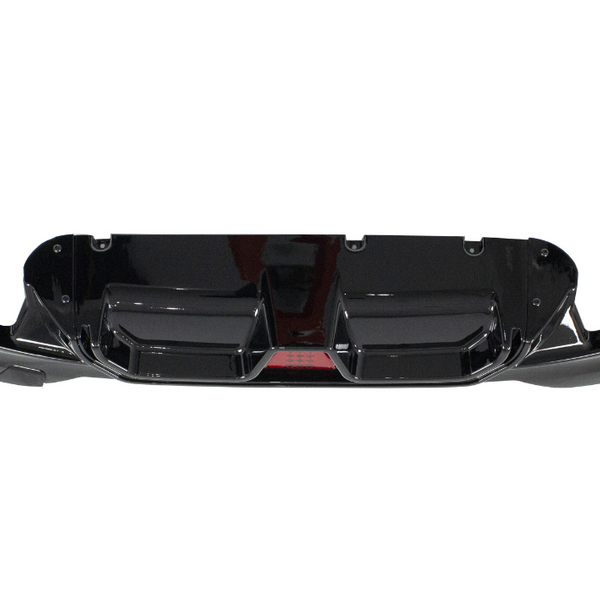 A shiny black car bumper with aerodynamic features is displayed against a white background, highlighting its sleek design and mounting points.