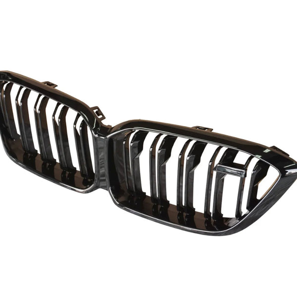 A black, dual-section car grille with vertical slats, positioned against a plain white background, typically used in the front of a vehicle.