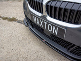 A car front displays a black license plate reading 