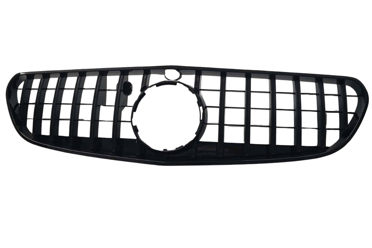 A black car grille features vertical and horizontal slats forming a rectangular pattern, with a circular opening in the center, set against a plain white background.