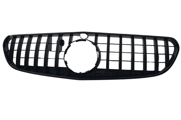 A black car grille features vertical and horizontal slats forming a rectangular pattern, with a circular opening in the center, set against a plain white background.