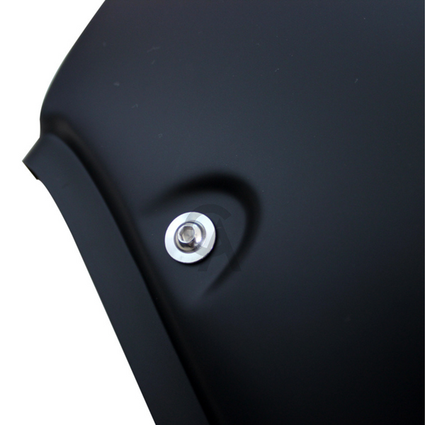A matte black curved surface featuring a single shiny silver bolt, set against a plain background, suggests mechanical or automotive context.