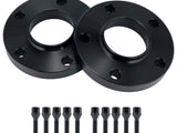 Two black wheel spacers with five bolt holes each, accompanied by ten matching black bolts, are arranged on a plain white background.