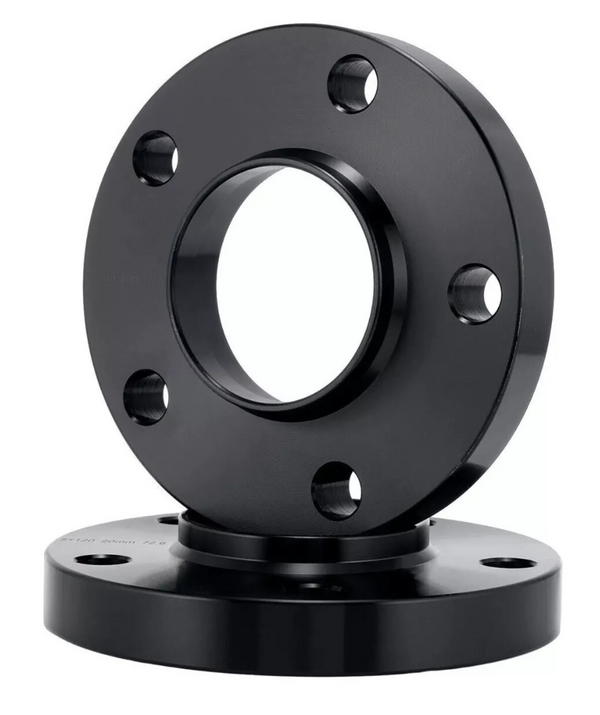 Two black metal flanges with multiple bolt holes are stacked vertically; the top flange is positioned upright. The setting appears to be a plain white studio background.