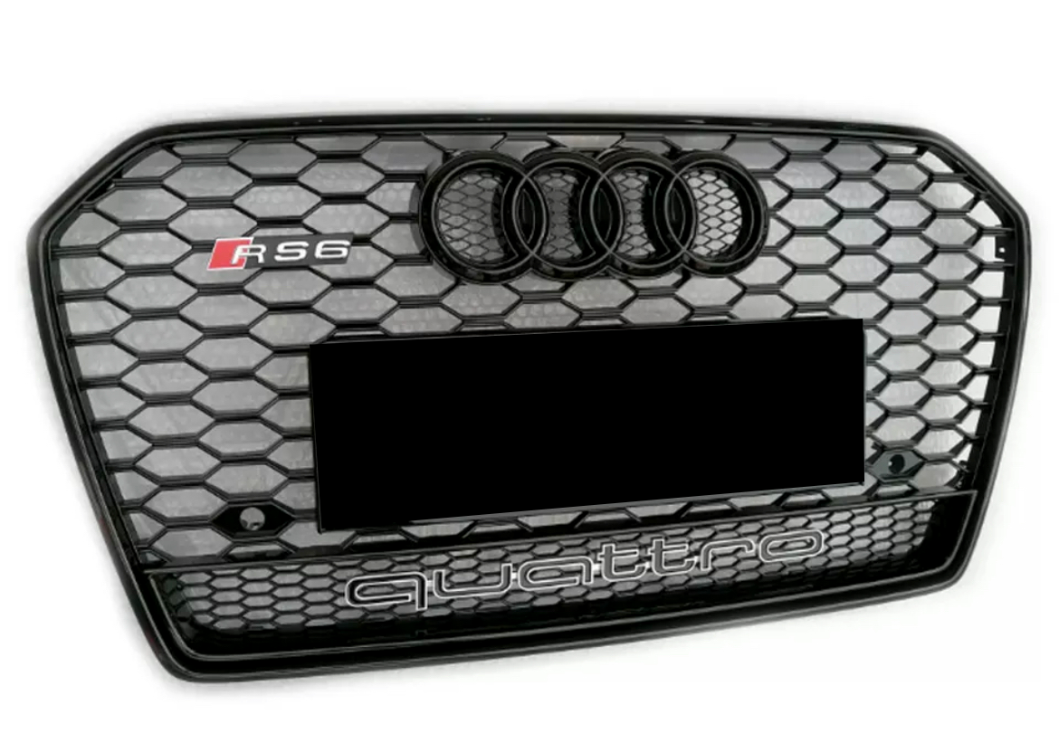 A hexagonal-patterned car grille displays the Audi logo and "RS6" on the top left. "quattro" is prominently indicated at the bottom against a black and silver honeycomb design.