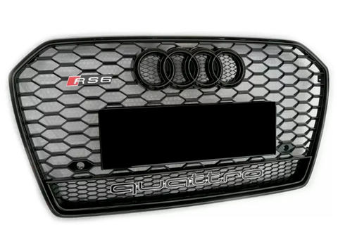 A hexagonal-patterned car grille displays the Audi logo and "RS6" on the top left. "quattro" is prominently indicated at the bottom against a black and silver honeycomb design.
