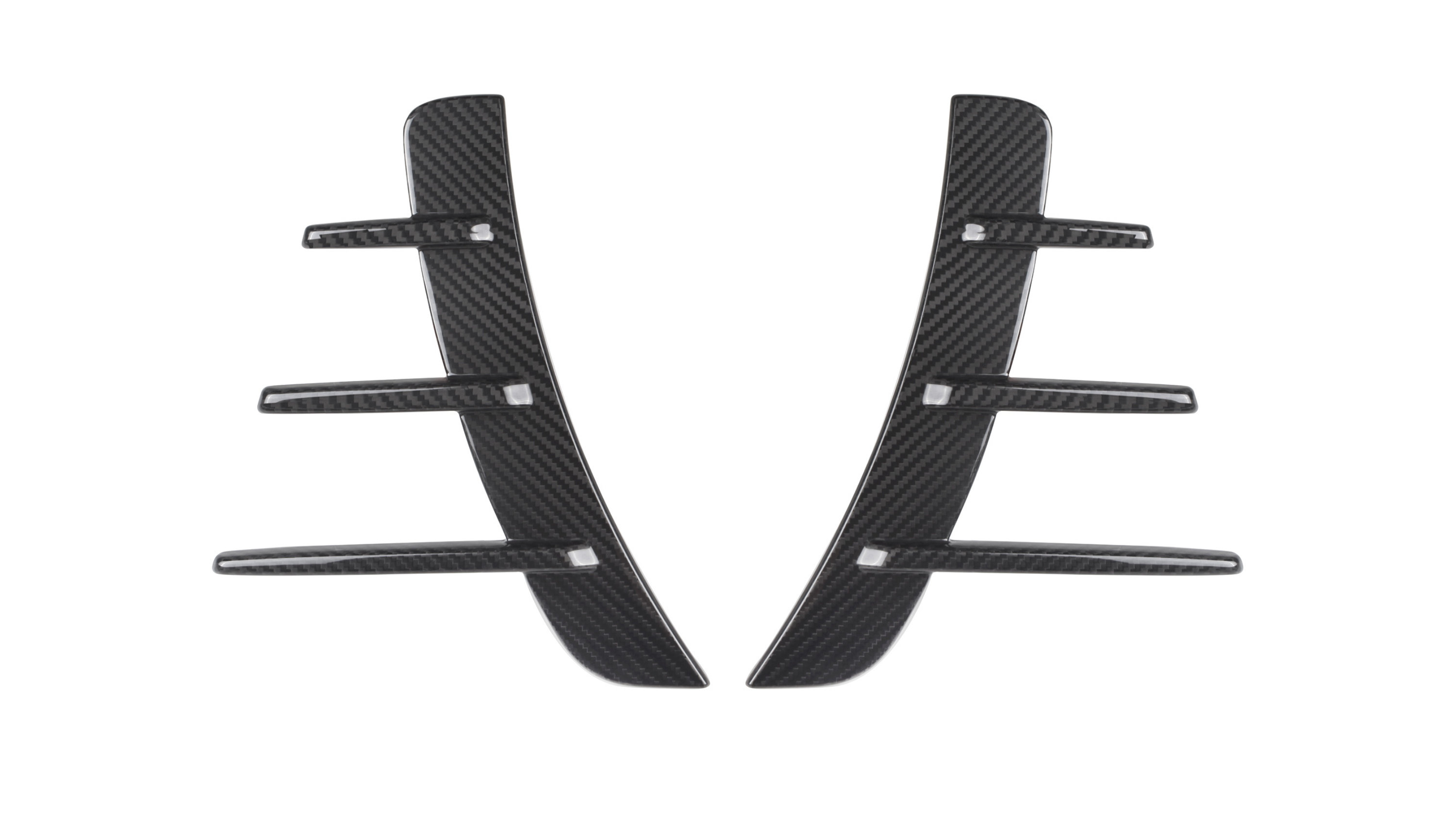 Carbon fiber car vent accents, featuring a central vertical piece with five horizontal fins, rest against a white background, showcasing their sleek and modern design.