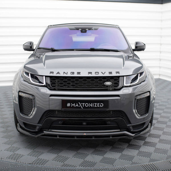 A gray Range Rover with sleek headlights faces forward, parked on a tiled floor. The text "RANGE ROVER" is on the hood and "#MAXTONIZED" on the front plate.