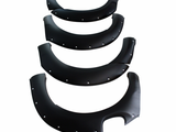 Four black fender flares, each progressively larger, are aligned vertically. They have silver rivet details and are set against a plain white background.