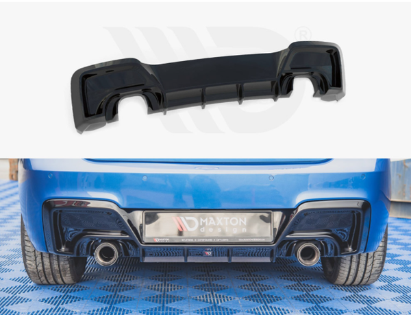 A black car diffuser, displayed separately above, is installed on the rear of a blue car, enhancing aerodynamics. The car sits on a blue patterned floor. Visible text: "MAXTON design".