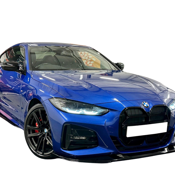 A sleek, blue BMW sports car is parked on a reflective surface, showcasing its prominent grille and polished alloy wheels against a plain black background.