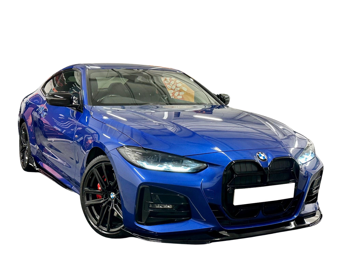 A sleek, blue BMW sports car is parked on a reflective surface, showcasing its prominent grille and polished alloy wheels against a plain black background.