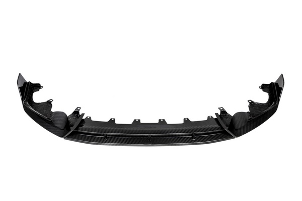 Curved black carbon fiber car bumper with mounting brackets, positioned horizontally against a plain white background, displaying a sleek design and intricate texture.