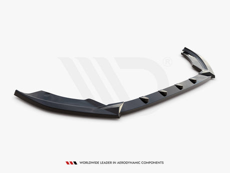 A sleek, black aerodynamic car bumper spoiler sits against a plain background. Below it, the text reads, "WORLDWIDE LEADER IN AERODYNAMIC COMPONENTS."