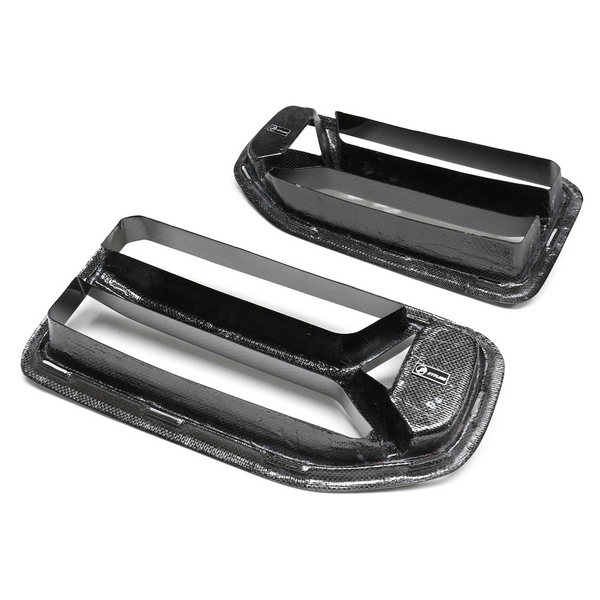 Carbon fiber car vents are displayed on a white background, featuring a sleek, aerodynamic design with two horizontal slats each. A small logo is visible in the corner.