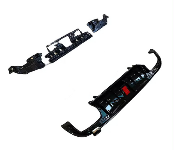 Black car bumpers are laid out separately on a plain white background, showcasing their curved and angular design features.