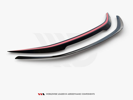 Two sleek, curved aerodynamic car spoilers are placed side by side on a white background. The upper spoiler features a red stripe. Bottom text reads: "WORLDWIDE LEADER IN AERODYNAMIC COMPONENTS."