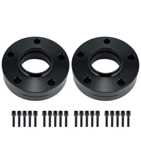 Two black wheel spacers with holes are aligned horizontally; each is accompanied by a row of ten matching black bolts beneath them. Set against a plain white background.
