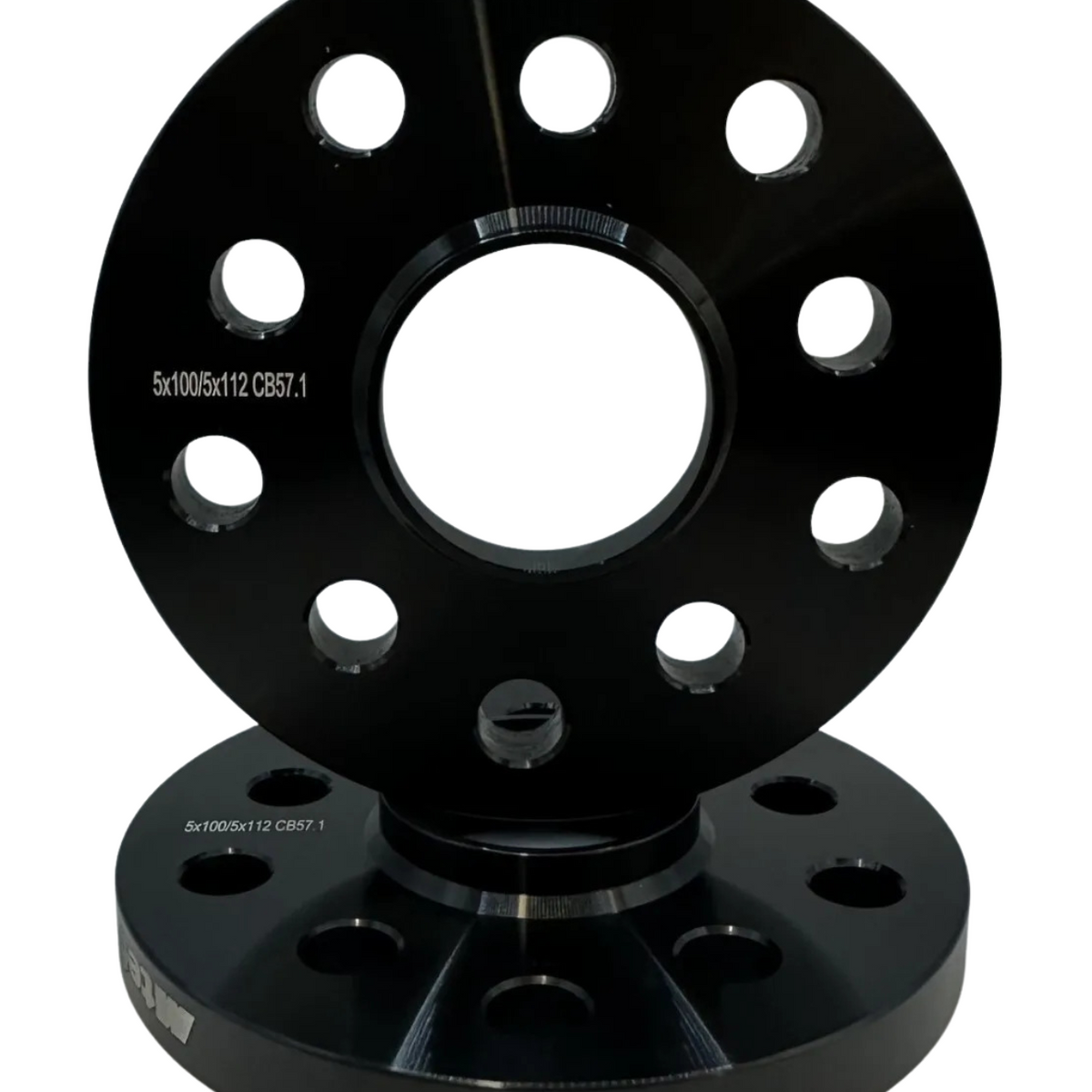 Two stacked black wheel spacers with multiple circular holes sit upright on a white background. Inscribed text reads: "5x100/5x112 CB57.1".