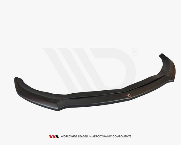 A sleek, black car front lip spoiler rests on a plain white background. Text beneath reads: "WORLDWIDE LEADER IN AERODYNAMIC COMPONENTS."