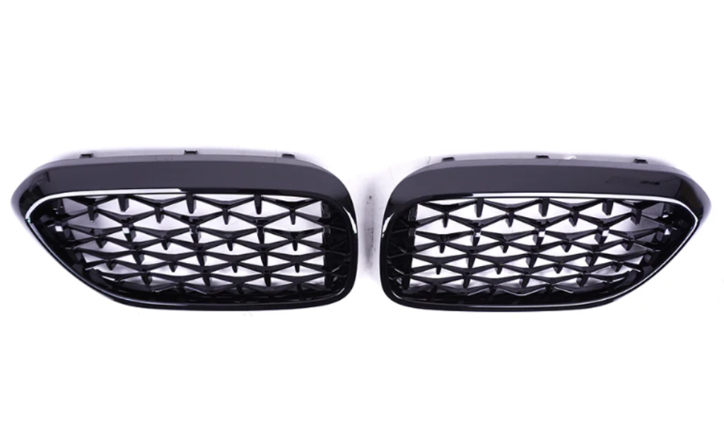 Two black car grilles with a diamond mesh pattern are positioned side by side on a plain white background.