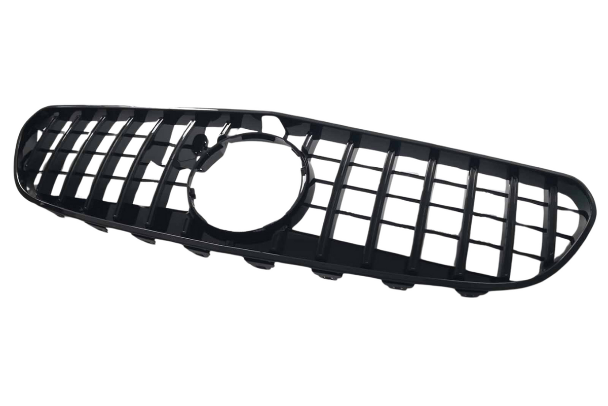 A black, rectangular car grille with a grid pattern and a circular opening in the center, set against a plain white background.
