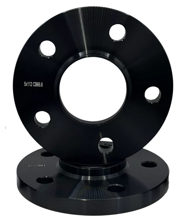 Two black metallic wheel spacers are positioned vertically, each with five bolt holes. The text "5x112 CB66.6" is engraved on both spacers. The background is plain white.