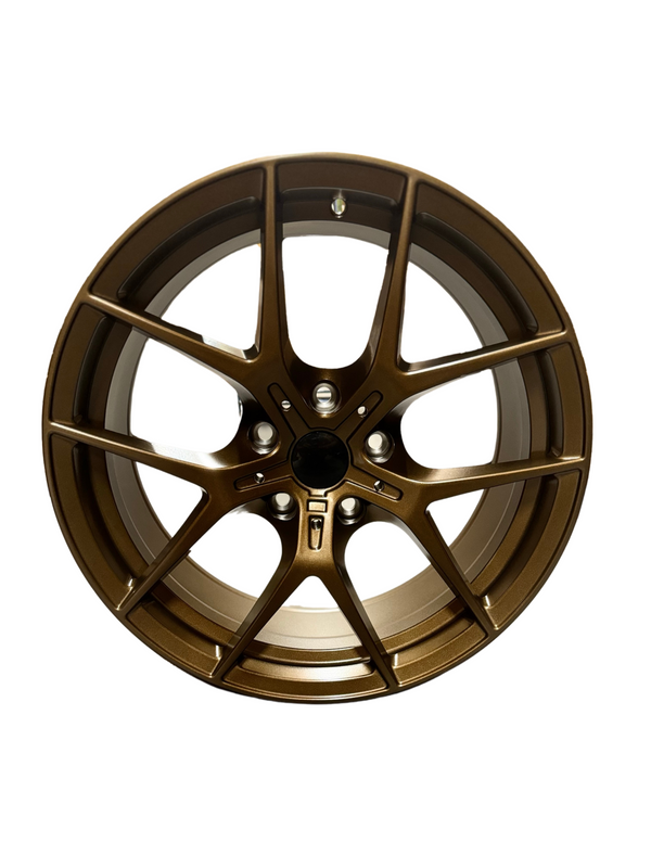 Bronze alloy wheel with a multi-spoke design, situated on a plain white background, featuring a central hub area for mounting. No text present.