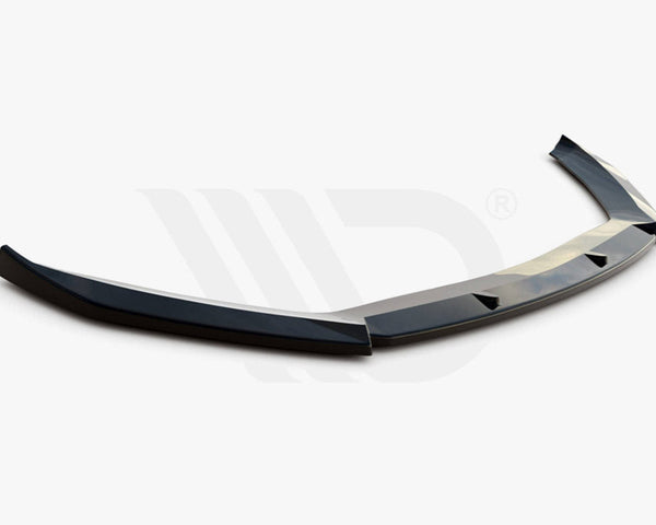 A black aerodynamic car spoiler lies on a white background. Text below reads: "WORLDWIDE LEADER IN AERODYNAMIC COMPONENTS."