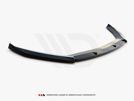 A black aerodynamic car spoiler lies on a white background. Text below reads: "WORLDWIDE LEADER IN AERODYNAMIC COMPONENTS."