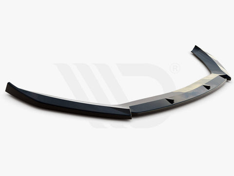 A black aerodynamic car spoiler lies on a white background. Text below reads: "WORLDWIDE LEADER IN AERODYNAMIC COMPONENTS."