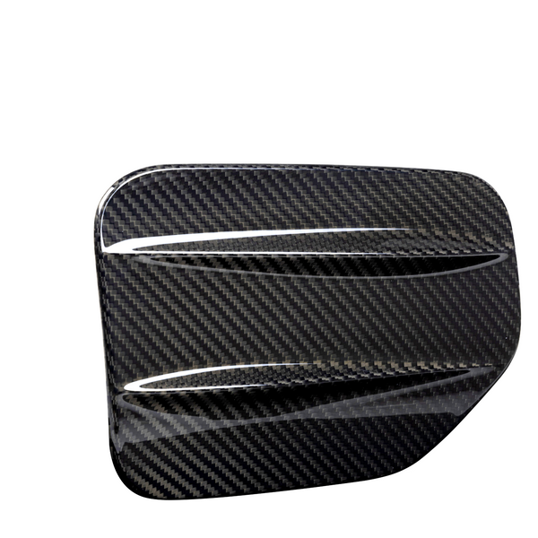 A sleek, carbon fiber car accessory with two aerodynamic ridges, set against a plain white background, showcasing its glossy textured pattern.