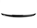 A sleek, black car spoiler curves slightly upward against a plain white background, designed for aerodynamic enhancement on vehicles.