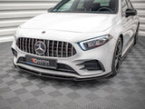 A white luxury car with a detailed front grille and distinctive headlights is parked in an indoor setting with patterned flooring. Logo text on plate reads: 