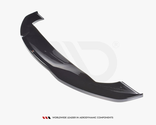 A sleek, black car spoiler, positioned diagonally, is showcased against a plain white background. Text reads, “WORLDWIDE LEADER IN AERODYNAMIC COMPONENTS,” emphasizing its premium quality.