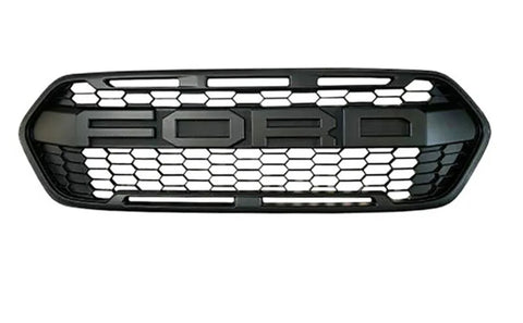 A black car grille features the text "FORD" in large letters against a hexagonal mesh pattern, set against a plain white background.