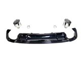 A black car bumper with attached exhaust tips and clamps arranged separately on a plain white background.