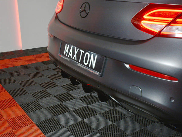 A rear view of a car with illuminated tail lights is parked on a checkered floor. The license plate reads "MAXTON." The floor has red and black tiles.