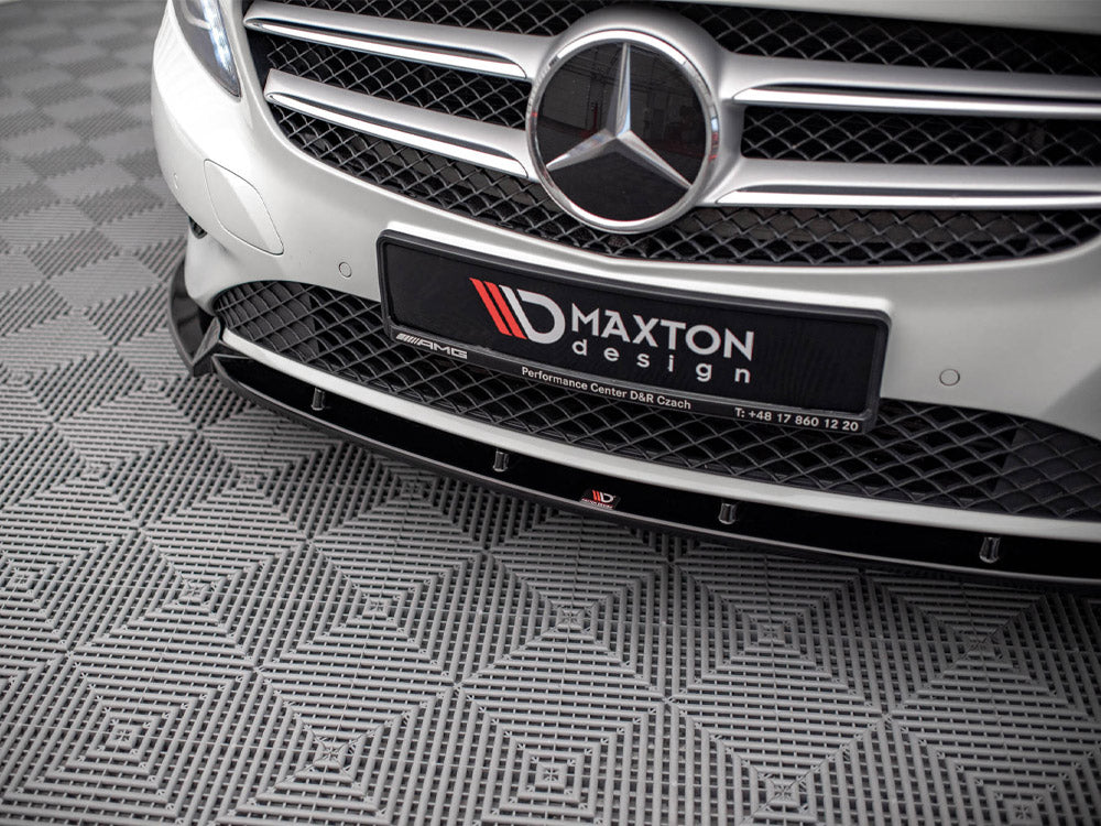 A car grille with a prominent emblem and "MAXTON design" plate is displayed. The vehicle is parked on a patterned, textured floor. Additional text: "Performance Center D&R Czach T: +48 17 860 12 20."