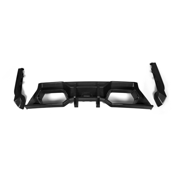 Carbon fiber diffuser with angular design lies on a white background, featuring multiple geometric cutouts and two separate side extensions. Central area displays the text "SCORPIO."