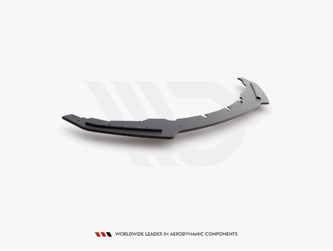 A curved, black aerodynamic car component lies on a plain white surface. Text reads: "WORLDWIDE LEADER IN AERODYNAMIC COMPONENTS."