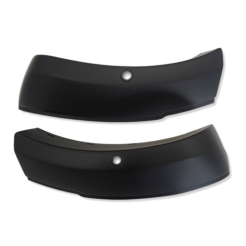 Two black curved bumper components with central round holes, positioned side by side against a plain white background.