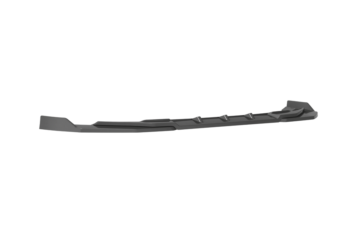 A long, black car side skirt lies horizontally against a plain white background, featuring angular edges and several triangular fins along its length.