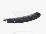 A black aerodynamic car diffuser, featuring multiple vertical fins, rests on a plain white background. Text: 