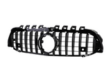 A black car grille with vertical slats, featuring a prominent circular emblem space in the center, isolated against a white background.