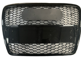 A black, rectangular grille with hexagonal mesh inserts is positioned on a white background. The grille features two rectangular sections, one obscured by a dark, reflective panel.