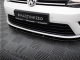 A white Volkswagen car is parked on patterned flooring. The license plate displays 