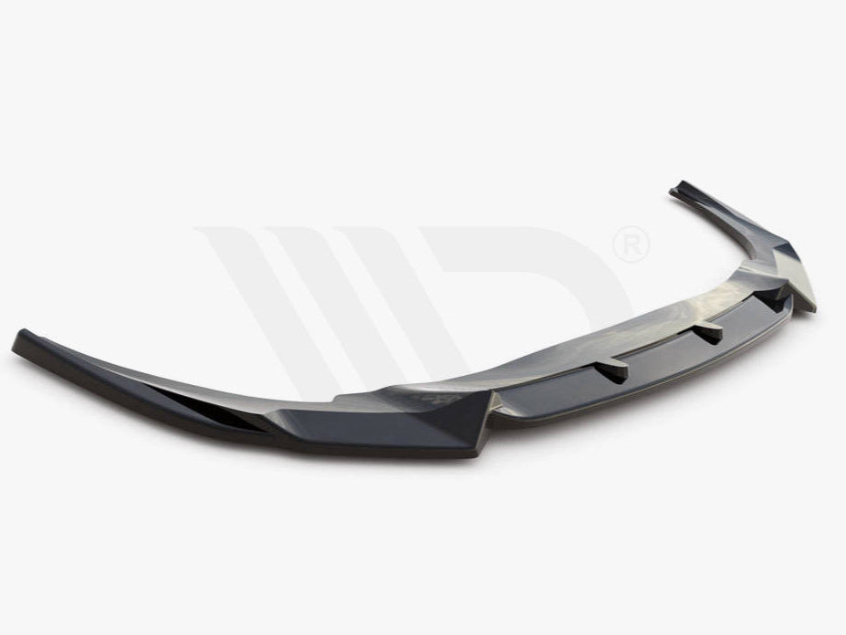 A sleek, black aerodynamic car spoiler is shown, extending horizontally with angled edges. It rests on a plain white background. Text reads: "WORLDWIDE LEADER IN AERODYNAMIC COMPONENTS."
