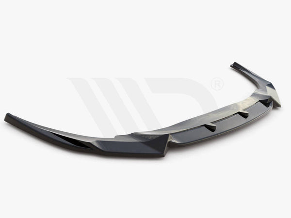 A sleek, black aerodynamic car spoiler is shown, extending horizontally with angled edges. It rests on a plain white background. Text reads: "WORLDWIDE LEADER IN AERODYNAMIC COMPONENTS."