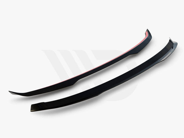Two black aerodynamic components, slightly curved with red accents, are positioned parallel against a light background. Below, text reads, "WORLDWIDE LEADER IN AERODYNAMIC COMPONENTS."